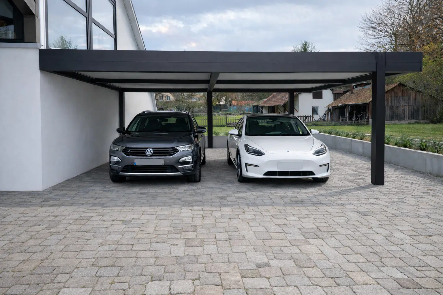 Carport double en aluminium noir mat avec deux véhicules stationnés, installation sur mesure à Muespach dans le Haut-Rhin
